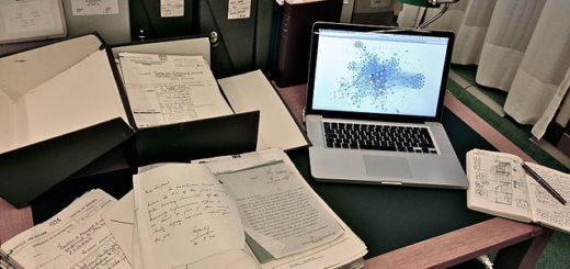 Laptop and papers on desk